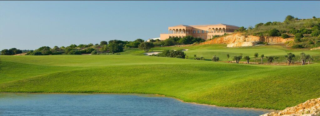 Amendoeira Faldo Golf Course clubhouse and lake